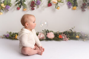 A floral theme for this little one's cake smash photo shoot with Aberdeen photographer Sharon Nicholson Photography